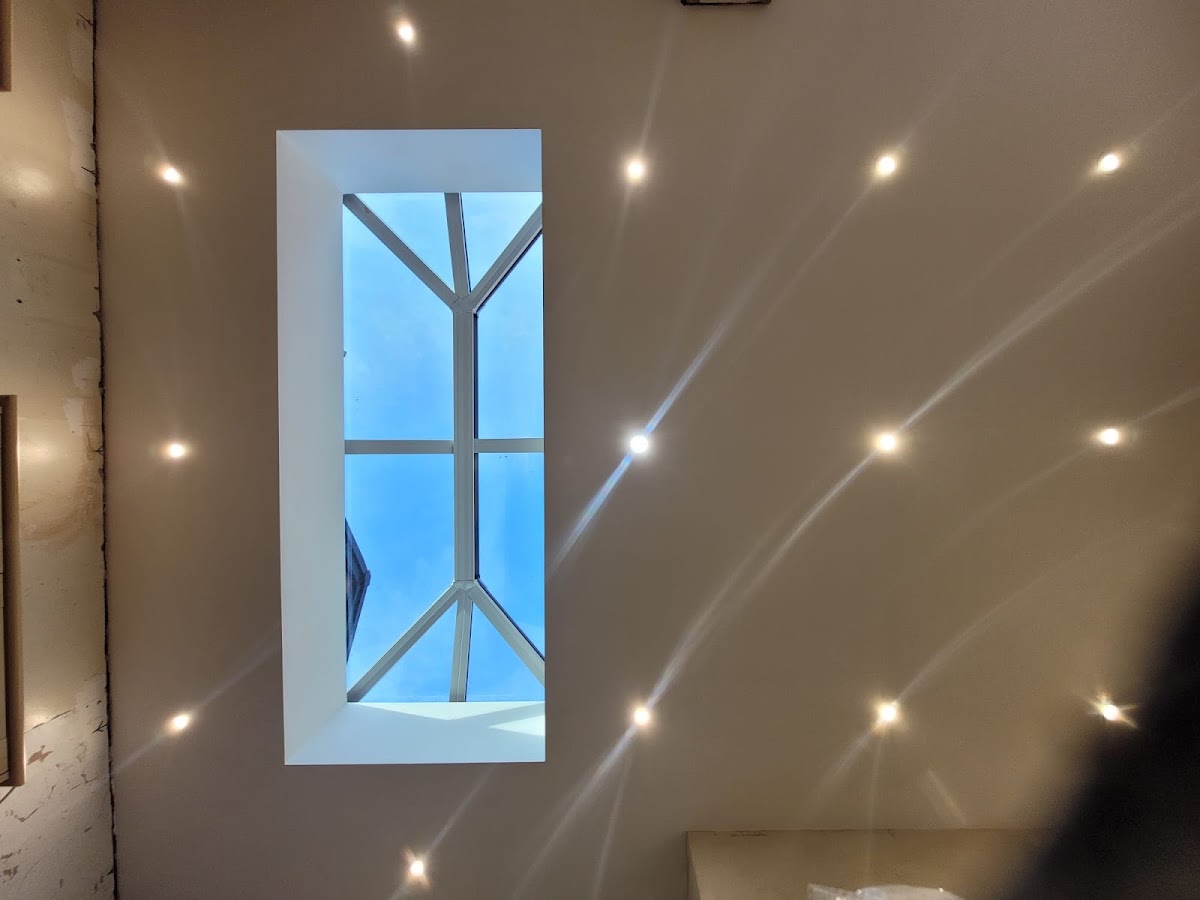 A finished roof lantern seen from inside the room below, with spotlights in the new ceiling
